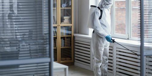 people-disinfecting-biohazard-area