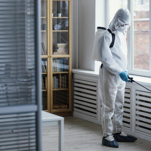 people-disinfecting-biohazard-area